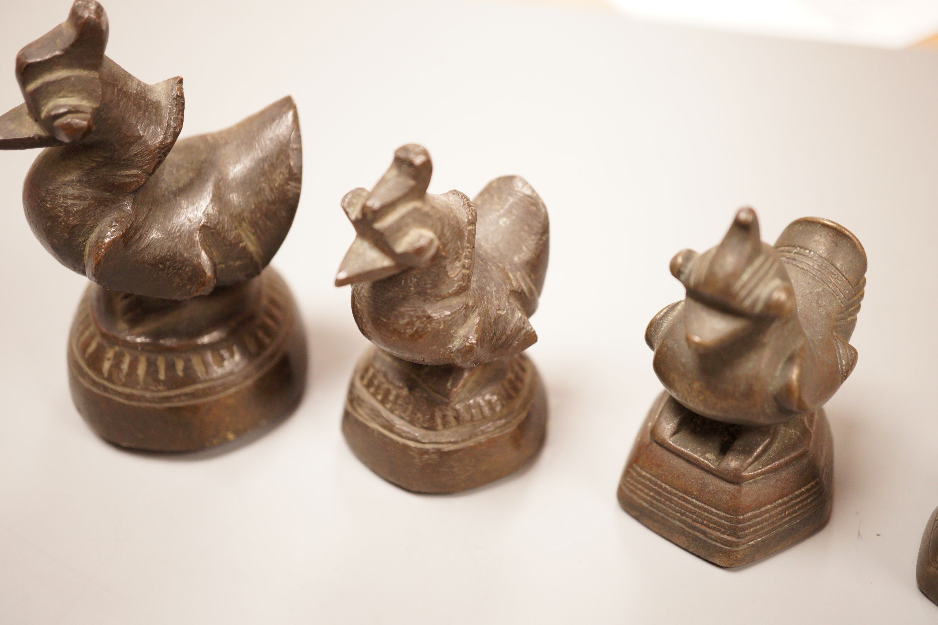 Six Burmese bronze duck opium weights, tallest 7cm